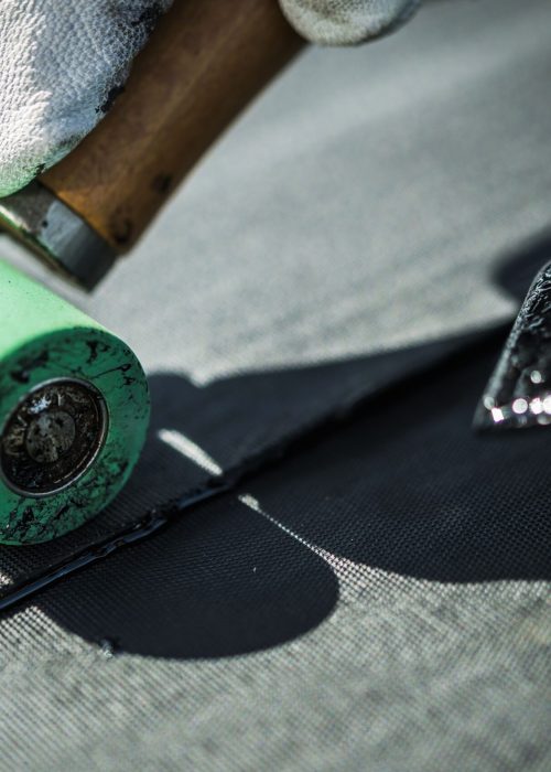 Roof Rubber EPDM Membrane Installation Close-Up. Roofing Industry Theme.