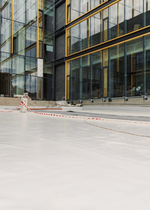 Waterproofing and insulation at construction site, waterproofing membrane preventing water penetration. Exterior vapor barrier for roof.