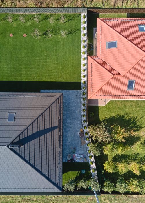Aerial view of residential house with backyard in suburban rural area.